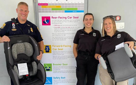 Child car seat installation at a City of Tampa fire station